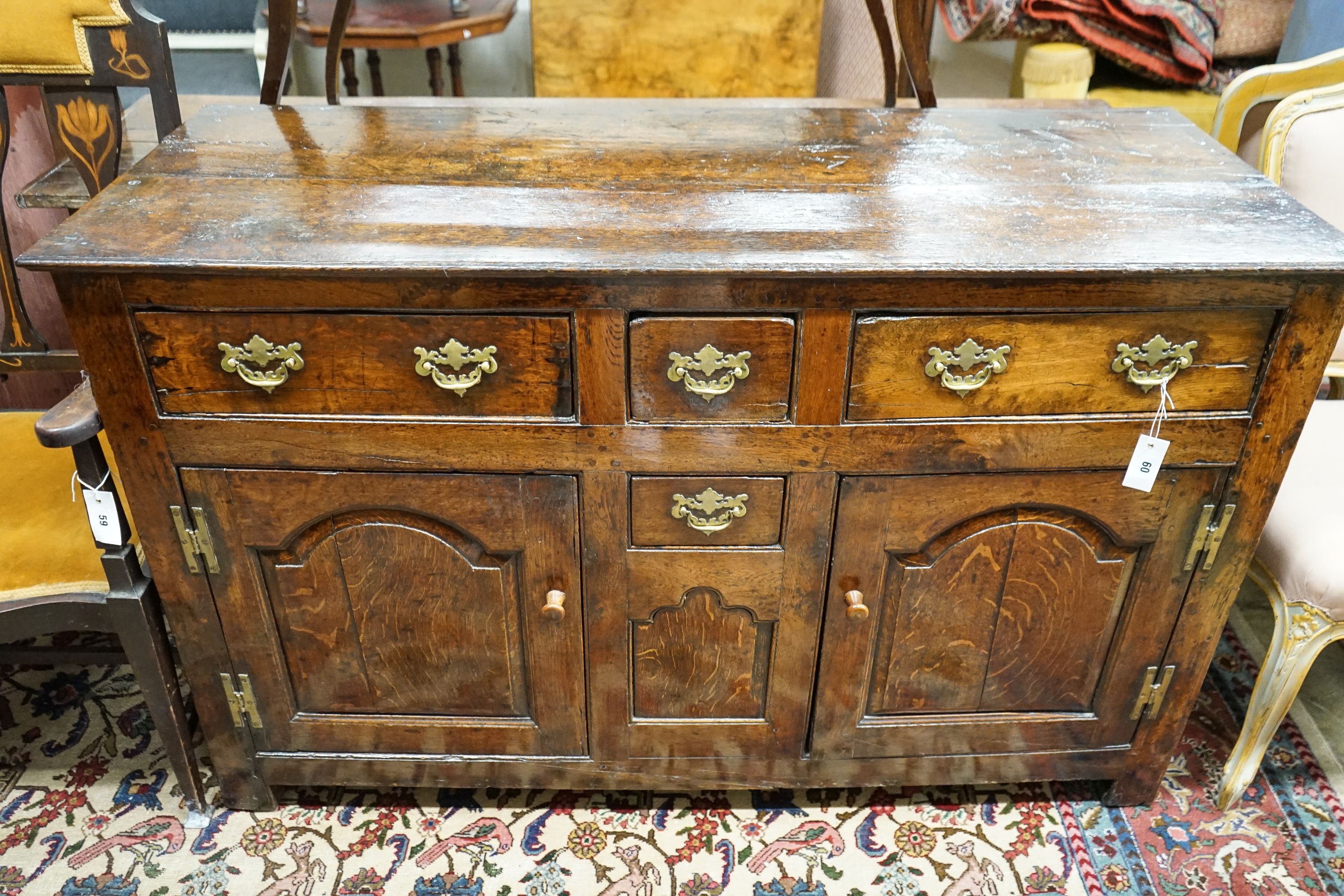 A mid 18th century oak dresser base, length 140cm, depth 55cm, height 88cm